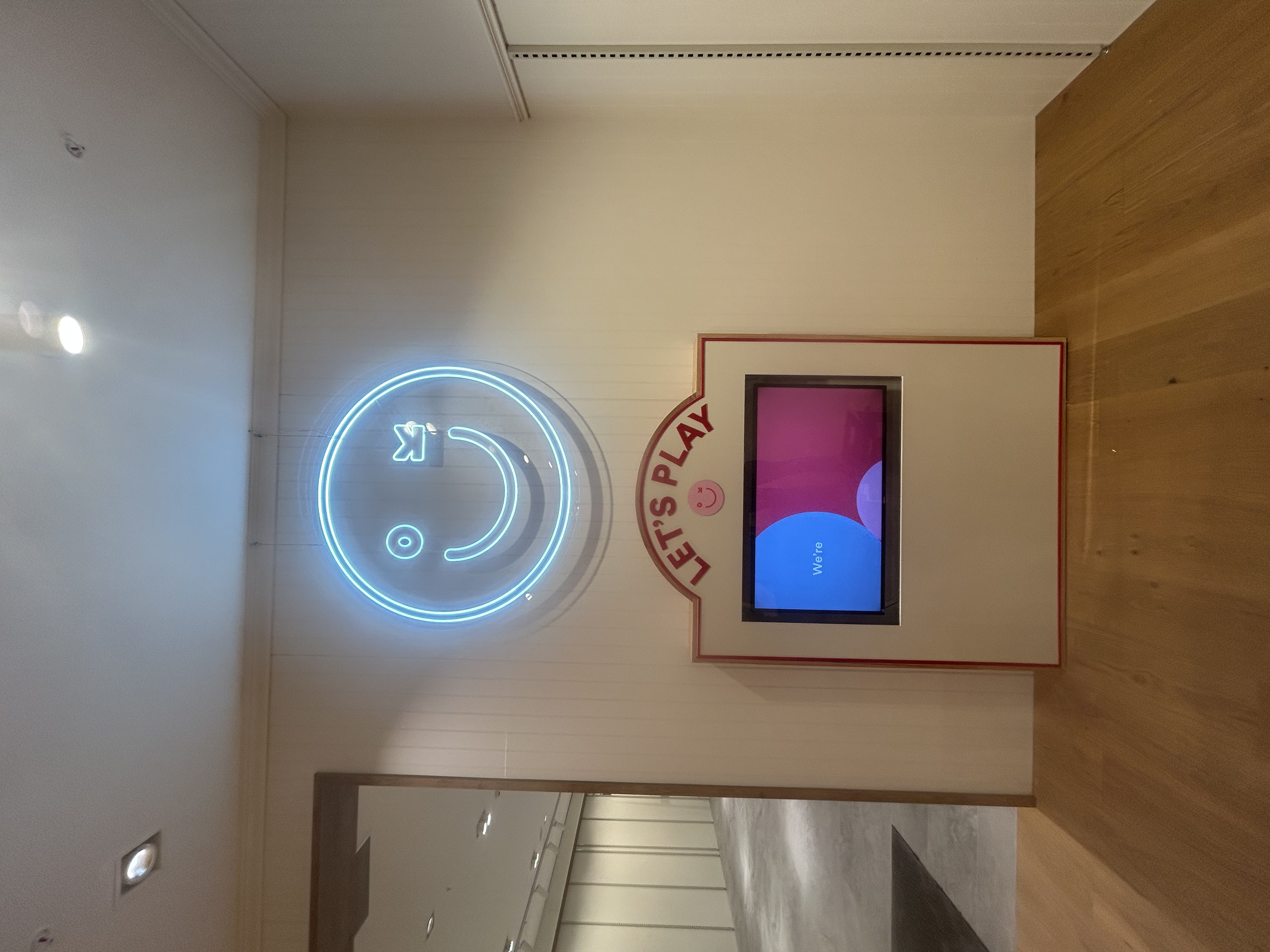 Large-format illuminated exterior signage at night