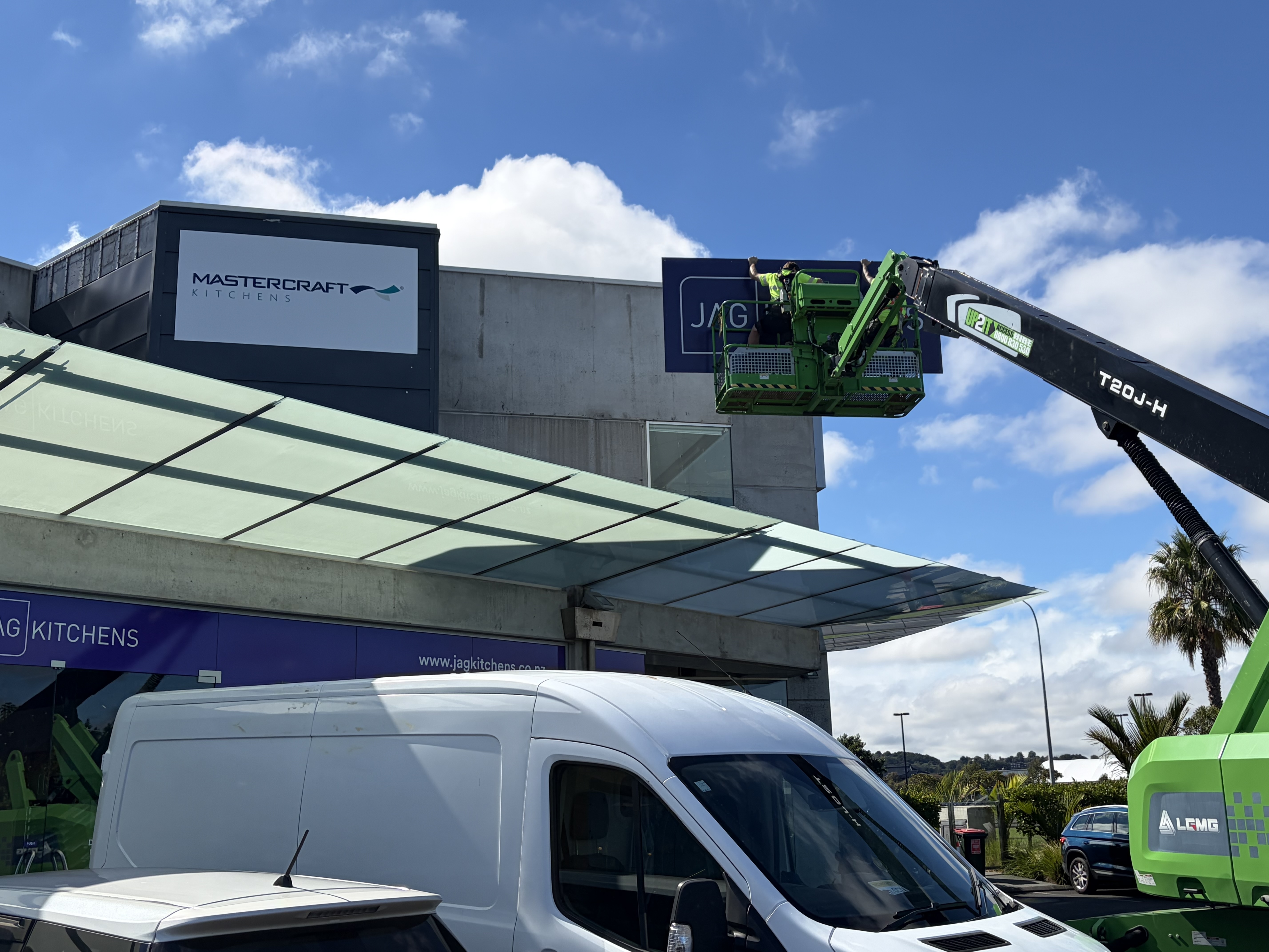 Brand Bunker team installing commercial signage on site